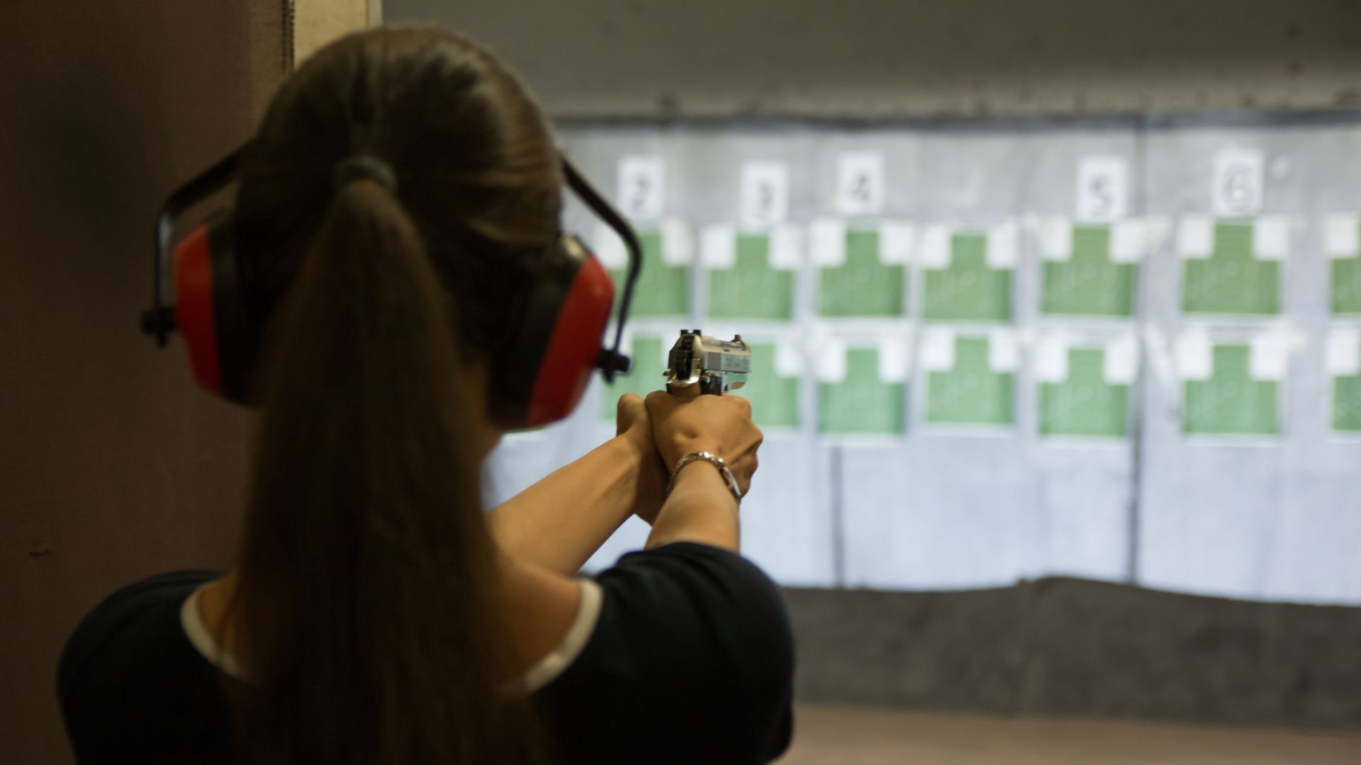 woman target practicing