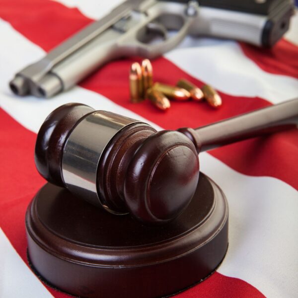 gun by a gavel