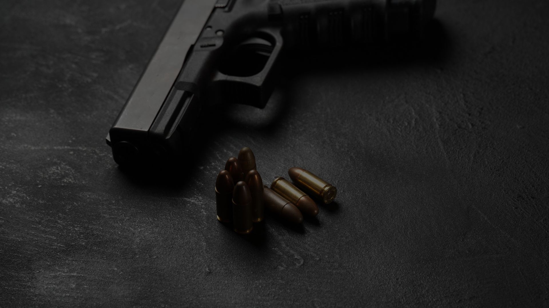 Gun with 6 bullets next to it