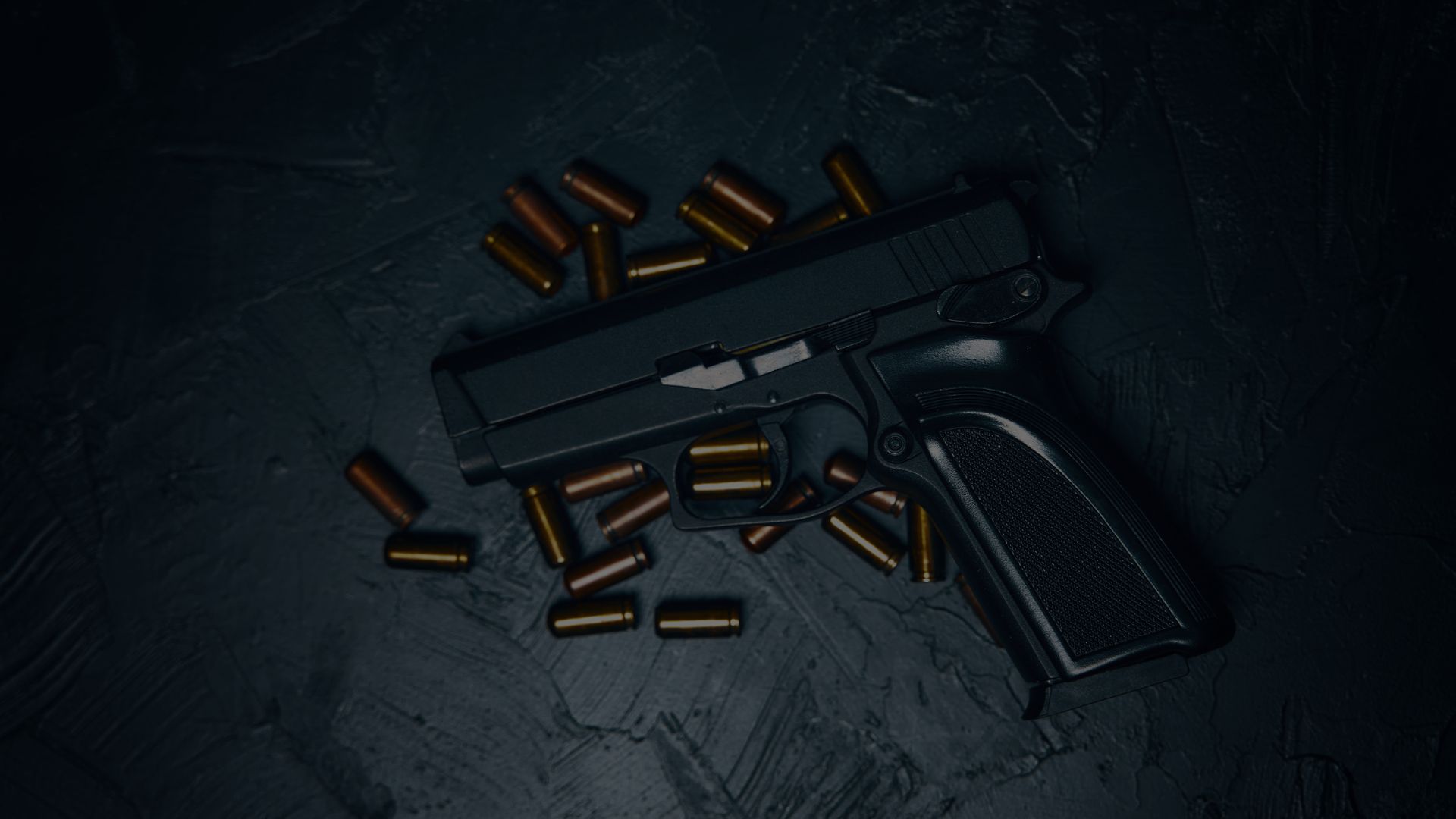 Gun with bullets around it