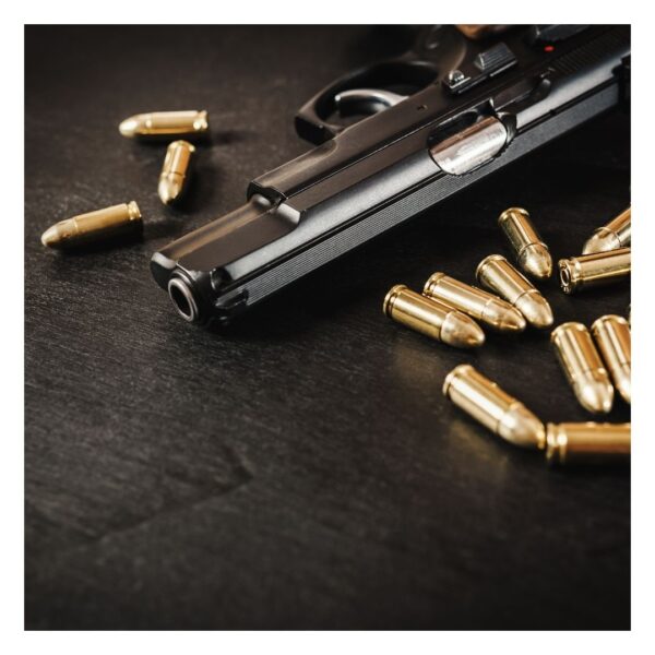 Gun with bullets around it