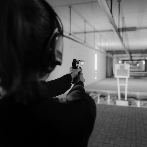 A woman training at a gun range
